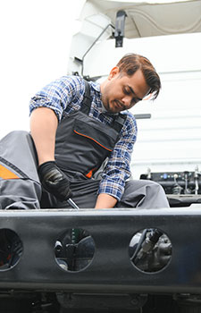 indian-mechanic-repairing-the-truck_225x350a
